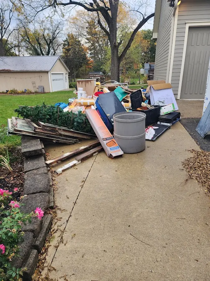 Dumpster being loaded with debris for 30 Yard Dumpster Rental in Ahuimanu